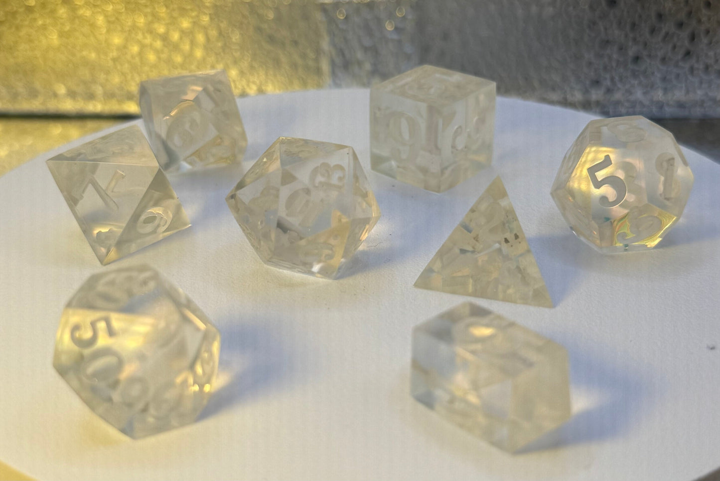 Clear 3D-printed master dice set, polished and ready to mold